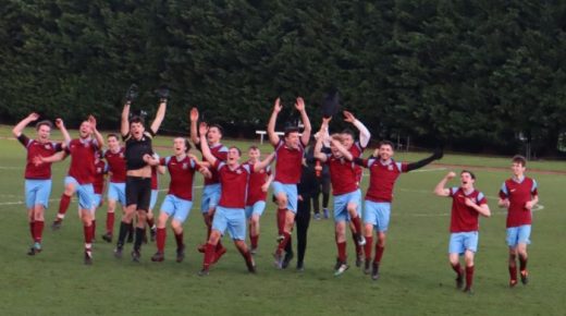 The men's team run across the pitch, arms waving in the air, as they celebrate their Cuppers victory