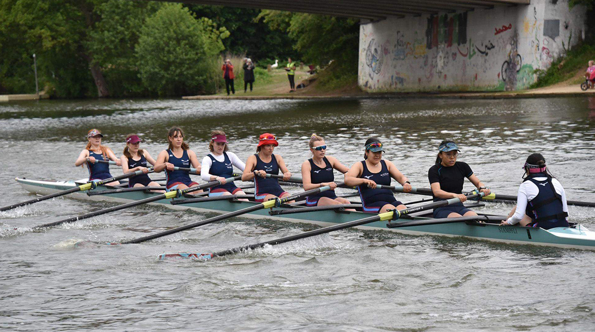 Women's boat club rowing on the river