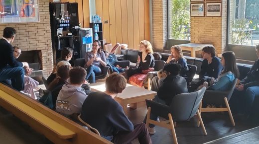 Offer-holders enjoying a discussion in the sunny JCR